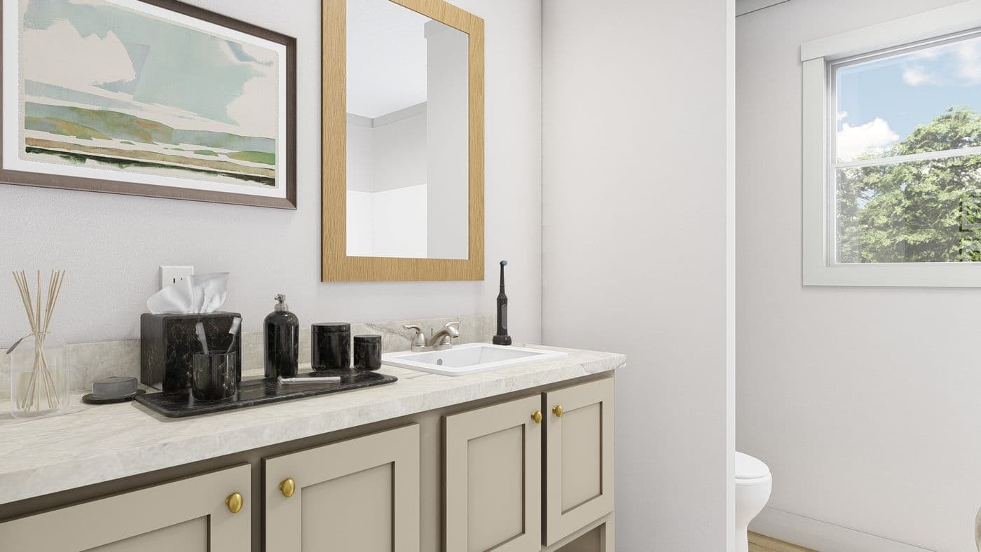 The HEY JUDE 7228-52-1 Guest Bathroom. This Manufactured Mobile Home features 5 bedrooms and 2 baths.