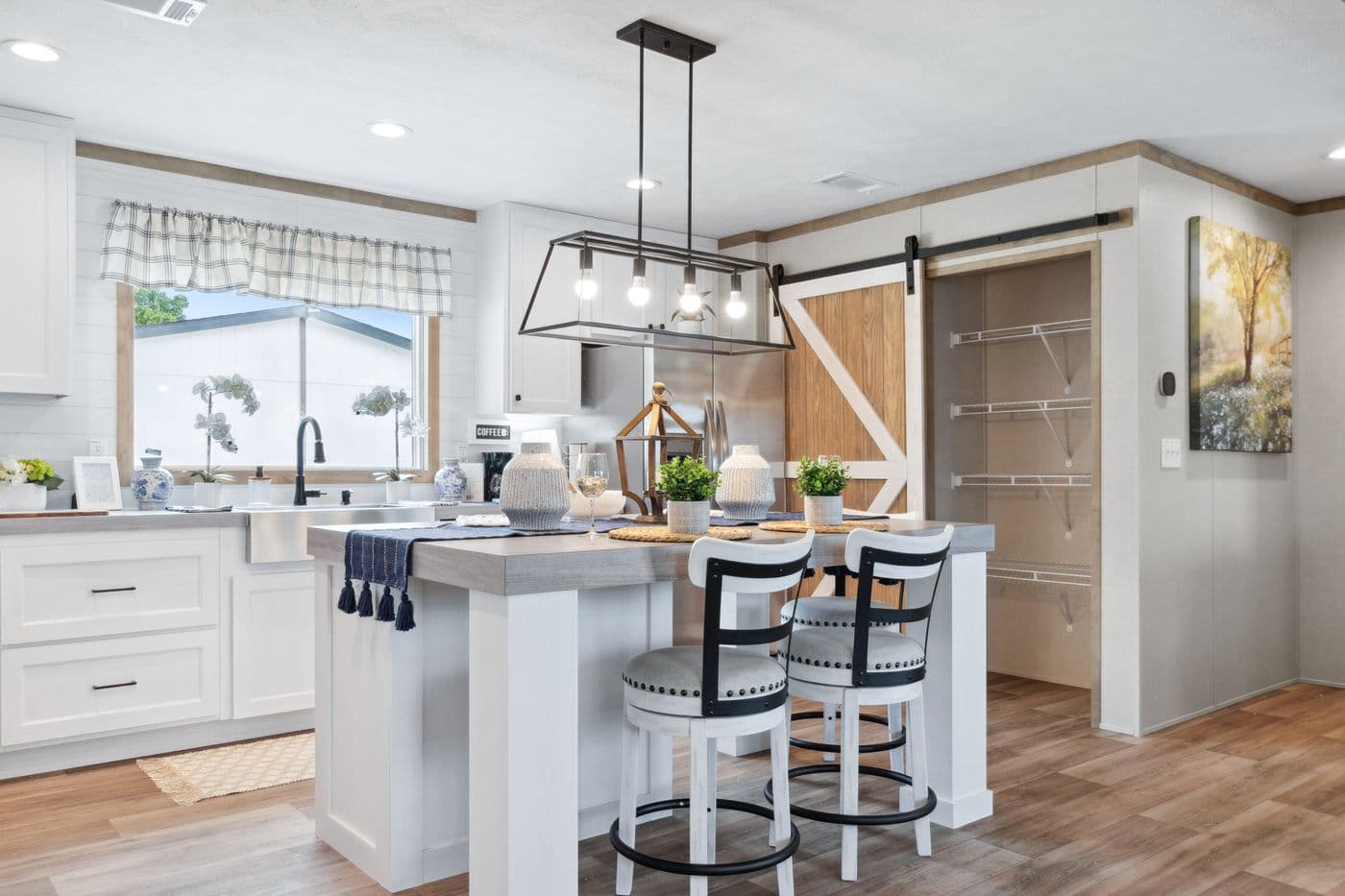 The BREEZE FARMHOUSE 72 Kitchen. This Manufactured Mobile Home features 4 bedrooms and 2 baths.