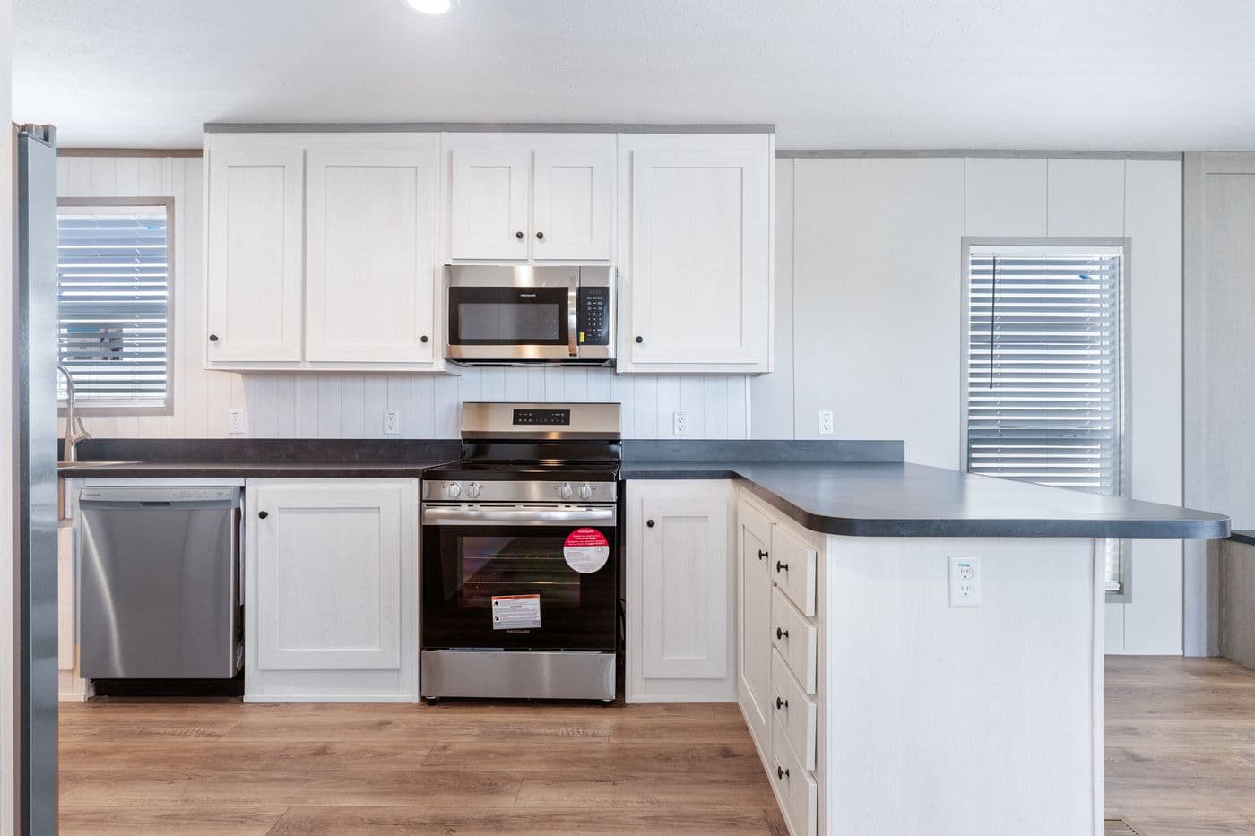 The RESOLUTION 16763K Kitchen. This Manufactured Mobile Home features 3 bedrooms and 2 baths.