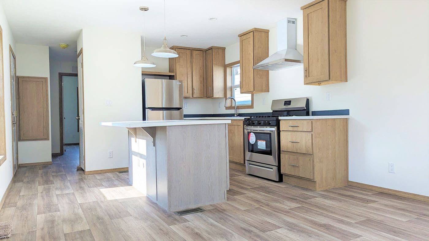 The RAMSEY 215-1 Kitchen. This Manufactured Mobile Home features 1 bedroom and 1 bath.