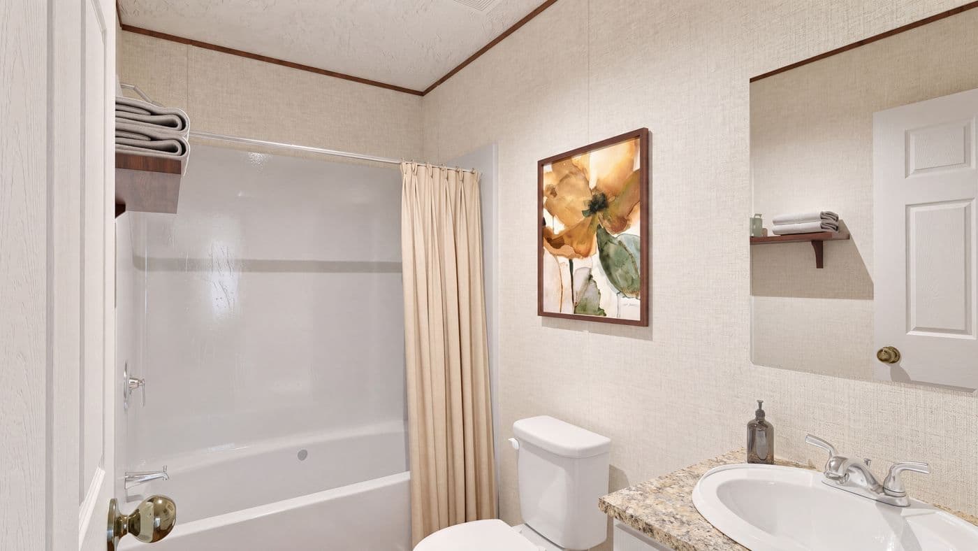 The REDWOOD Guest Bathroom. This Manufactured Mobile Home features 5 bedrooms and 3 baths.