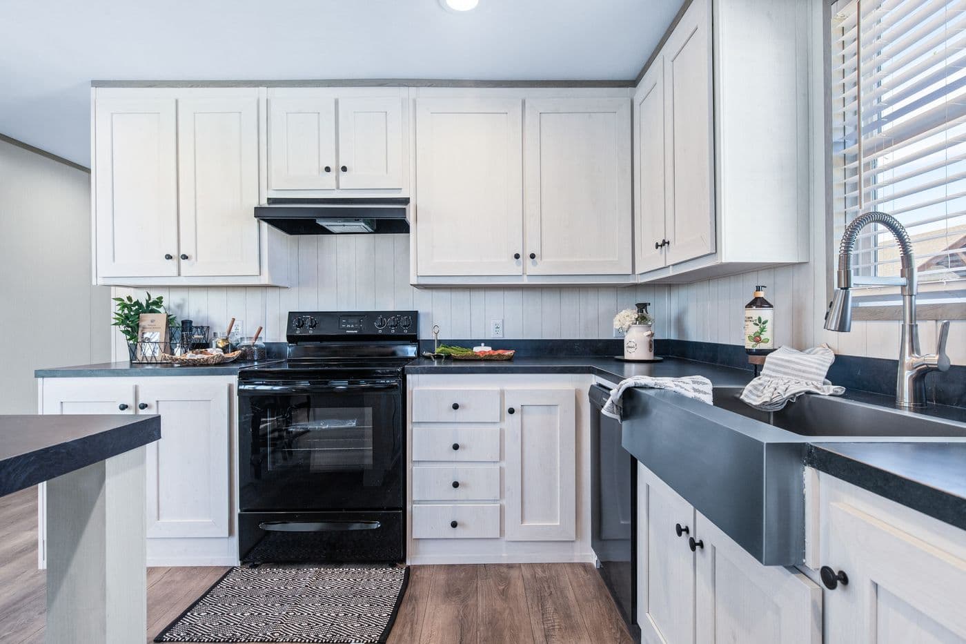 The PORCH LIVING SERIES 16682A Kitchen. This Manufactured Mobile Home features 2 bedrooms and 2 baths.