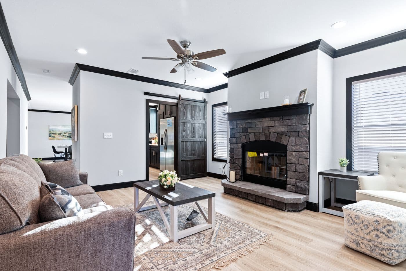 The THE LOUIS Family Room. This Manufactured Mobile Home features 4 bedrooms and 3 baths.