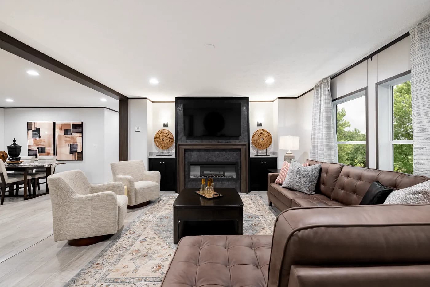The CRESTWOOD Living Room. This Manufactured Mobile Home features 3 bedrooms and 2 baths.