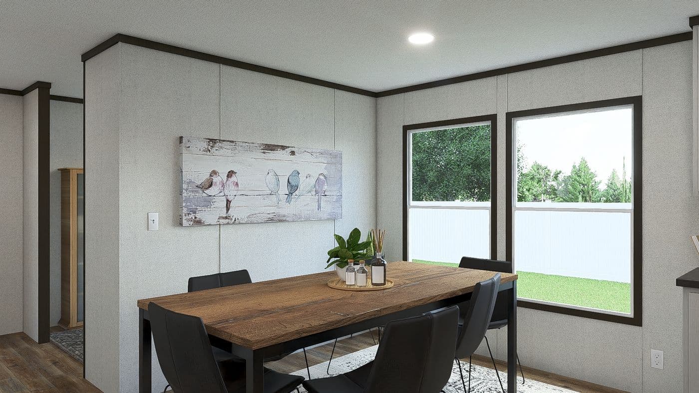 The IMPACT Dining Area. This Manufactured Mobile Home features 4 bedrooms and 2 baths.