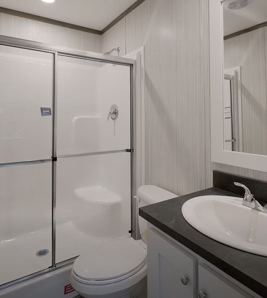 The PERIDOT Guest Bathroom. This Manufactured Mobile Home features 2 bedrooms and 1 bath.