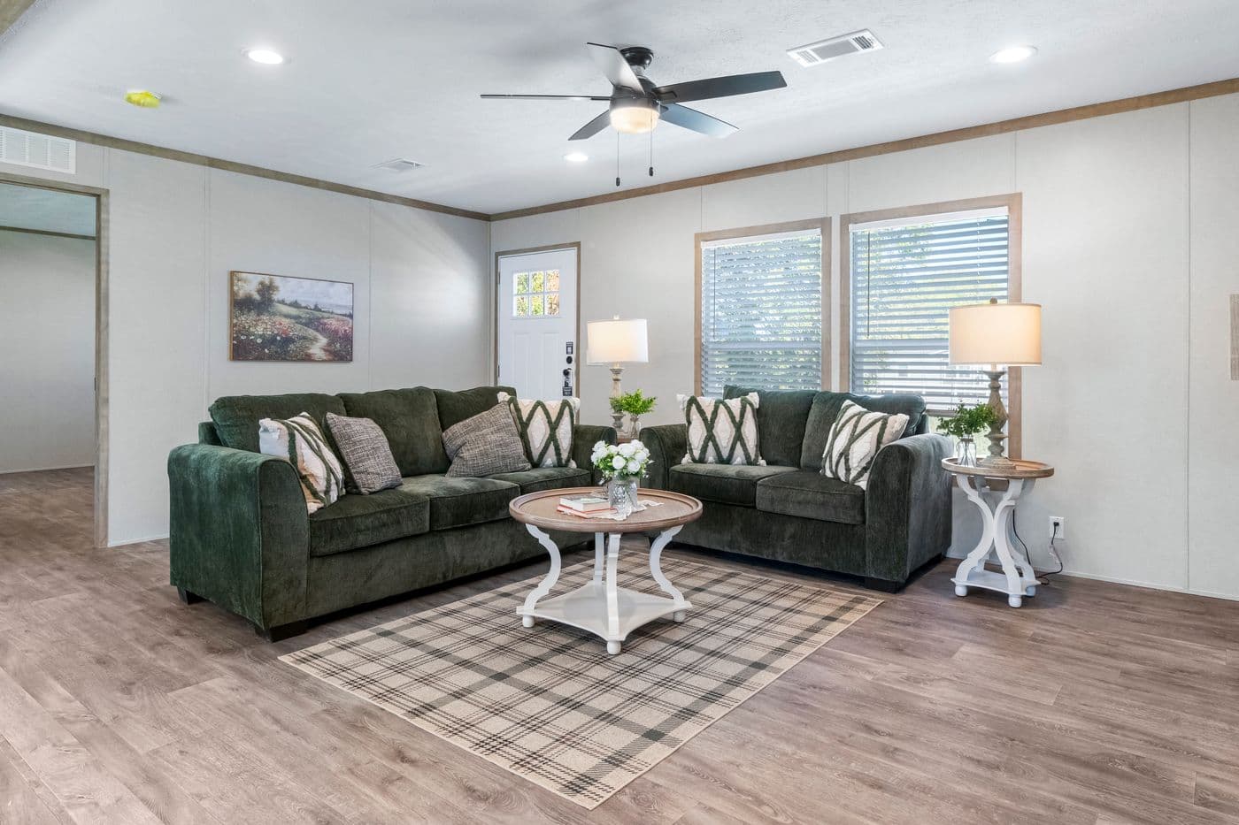 The THE BIG DEAL 52 Living Room. This Manufactured Mobile Home features 3 bedrooms and 2 baths.