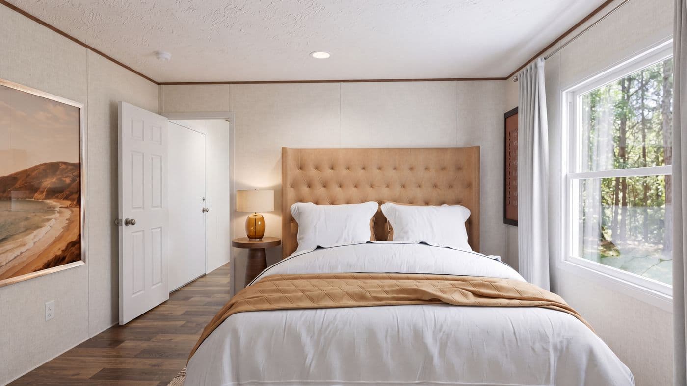 The HICKORY Primary Bedroom. This Manufactured Mobile Home features 3 bedrooms and 2 baths.