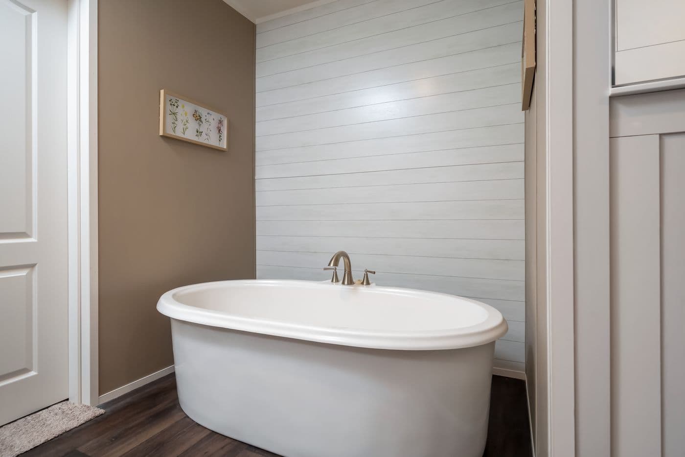 The ISLAND BREEZE 64 Primary Bathroom. This Manufactured Mobile Home features 4 bedrooms and 2 baths.