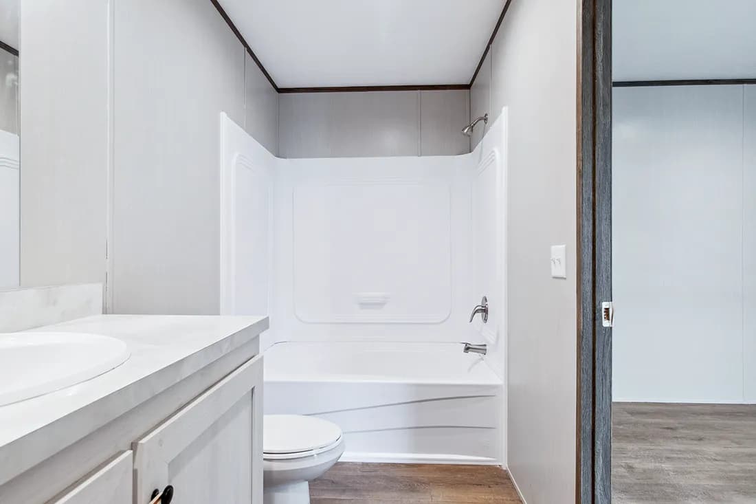 The HOMESTEAD 16562A Primary Bathroom. This Manufactured Mobile Home features 2 bedrooms and 2 baths.