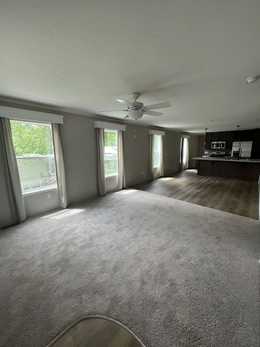 The JADE 40 Living Room. This Manufactured Mobile Home features 2 bedrooms and 2 baths.