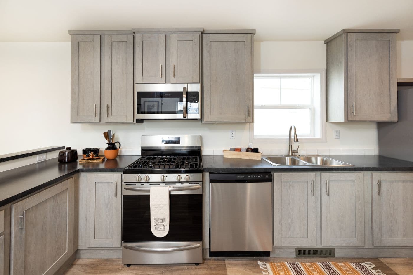 The RAMSEY 216-2 Kitchen. This Manufactured Mobile Home features 3 bedrooms and 2 baths.