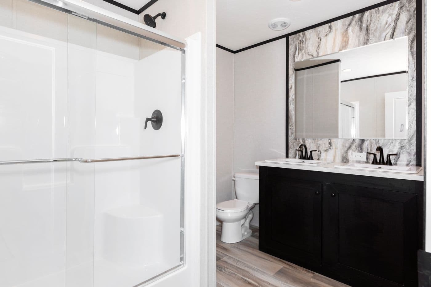The THE FUJI Primary Bathroom. This Manufactured Mobile Home features 3 bedrooms and 2 baths.