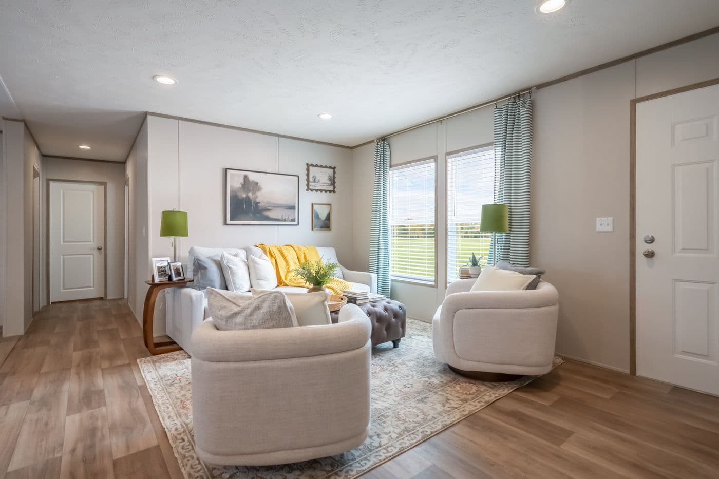 The VISTA Living Room. This Manufactured Mobile Home features 3 bedrooms and 2 baths.
