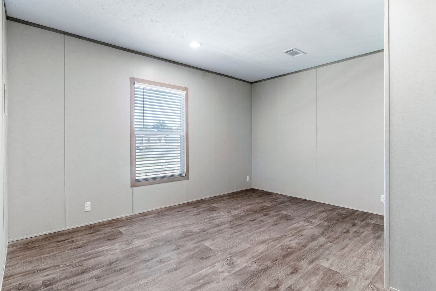 The THE BIG DEAL 52 Guest Bedroom. This Manufactured Mobile Home features 3 bedrooms and 2 baths.