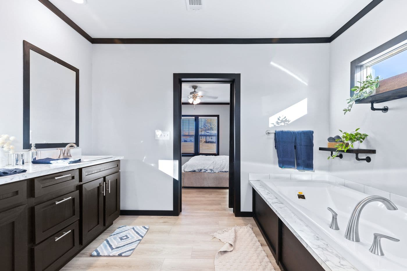 The THE LOUIS Primary Bathroom. This Manufactured Mobile Home features 4 bedrooms and 3 baths.