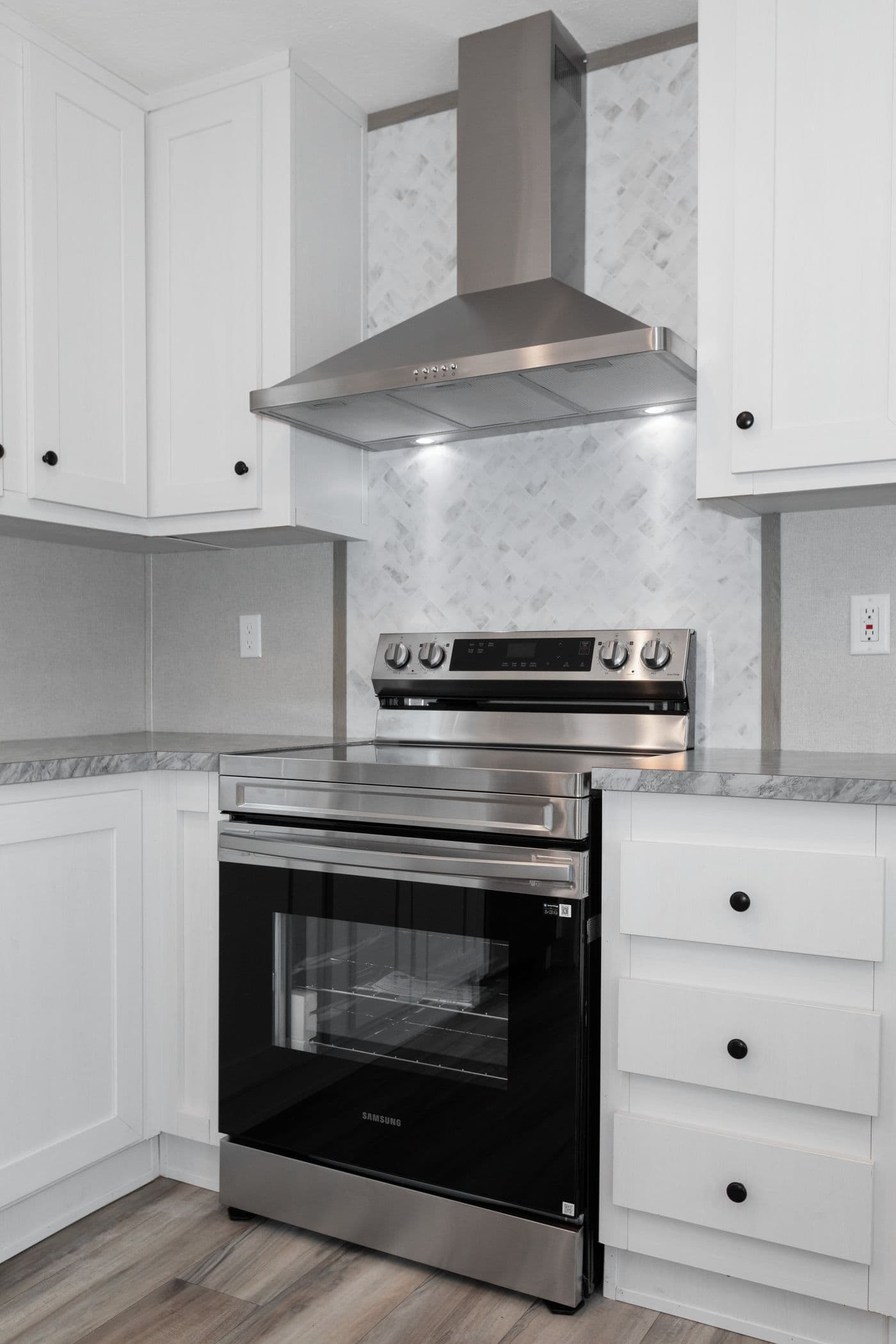 The THE ULTIMATE SHOWER Kitchen. This Manufactured Mobile Home features 3 bedrooms and 2 baths.