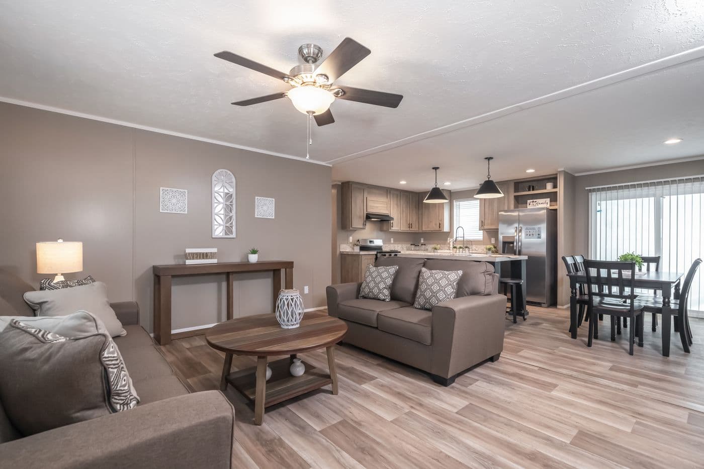 The TRADITION 56D Living Room. This Manufactured Mobile Home features 3 bedrooms and 2 baths.