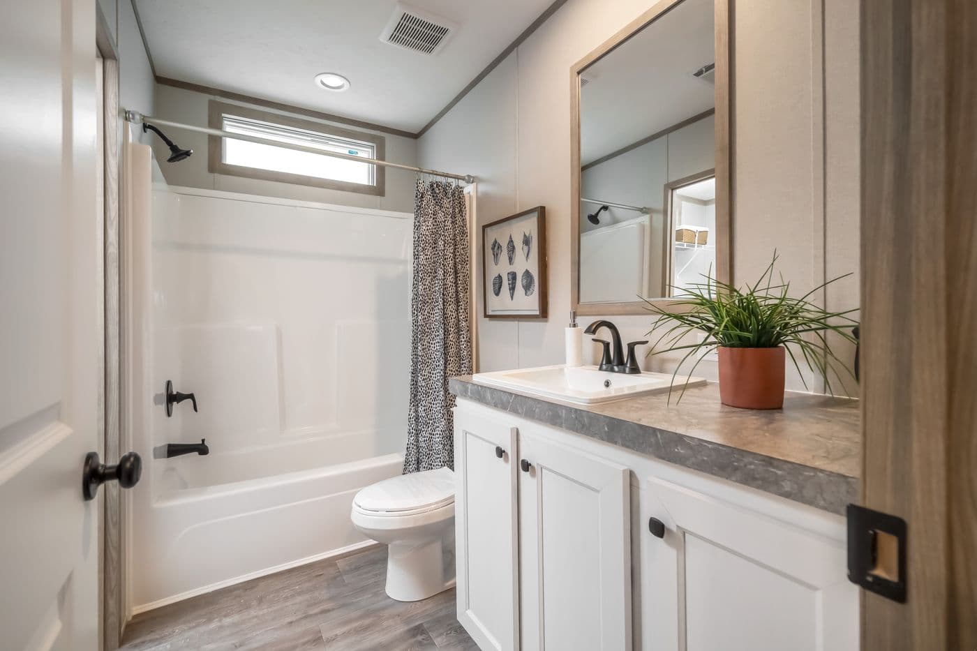 The PT 78 Guest Bathroom. This Manufactured Mobile Home features 3 bedrooms and 2 baths.