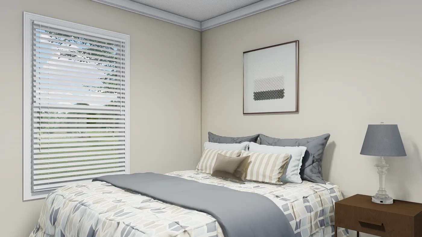 The CAROLINIAN M5010 Bedroom. This Manufactured Mobile Home features 3 bedrooms and 2 baths.