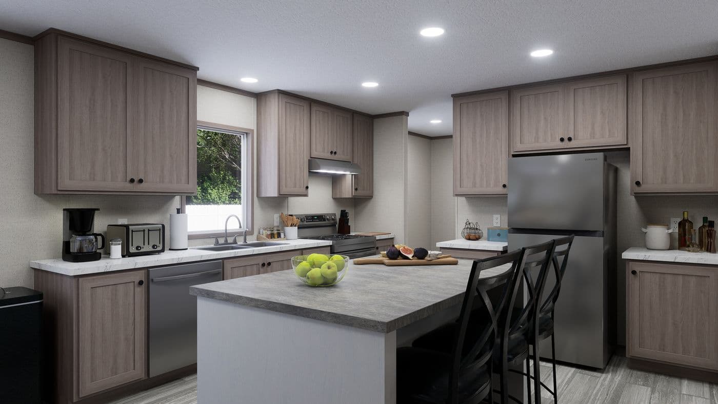 The THE MOUNTAINEER 60 Kitchen. This Manufactured Mobile Home features 3 bedrooms and 2 baths.
