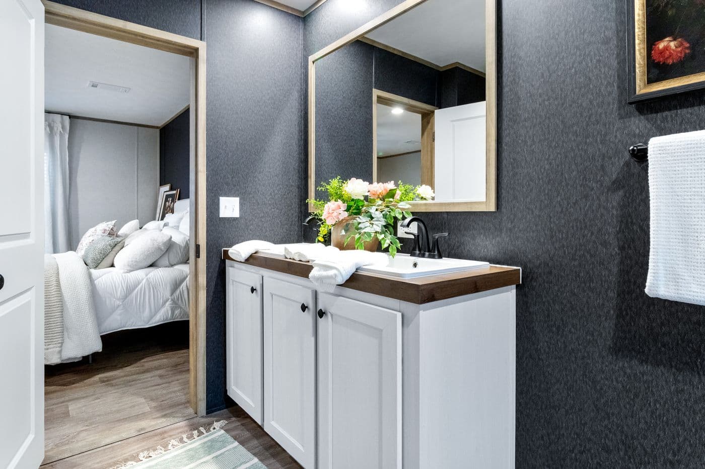 The EL SUENO BREEZE Primary Bathroom. This Manufactured Mobile Home features 4 bedrooms and 2 baths.