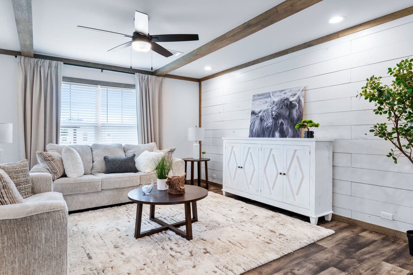 The SAWYER ELITE Living Room. This Manufactured Mobile Home features 3 bedrooms and 2 baths.