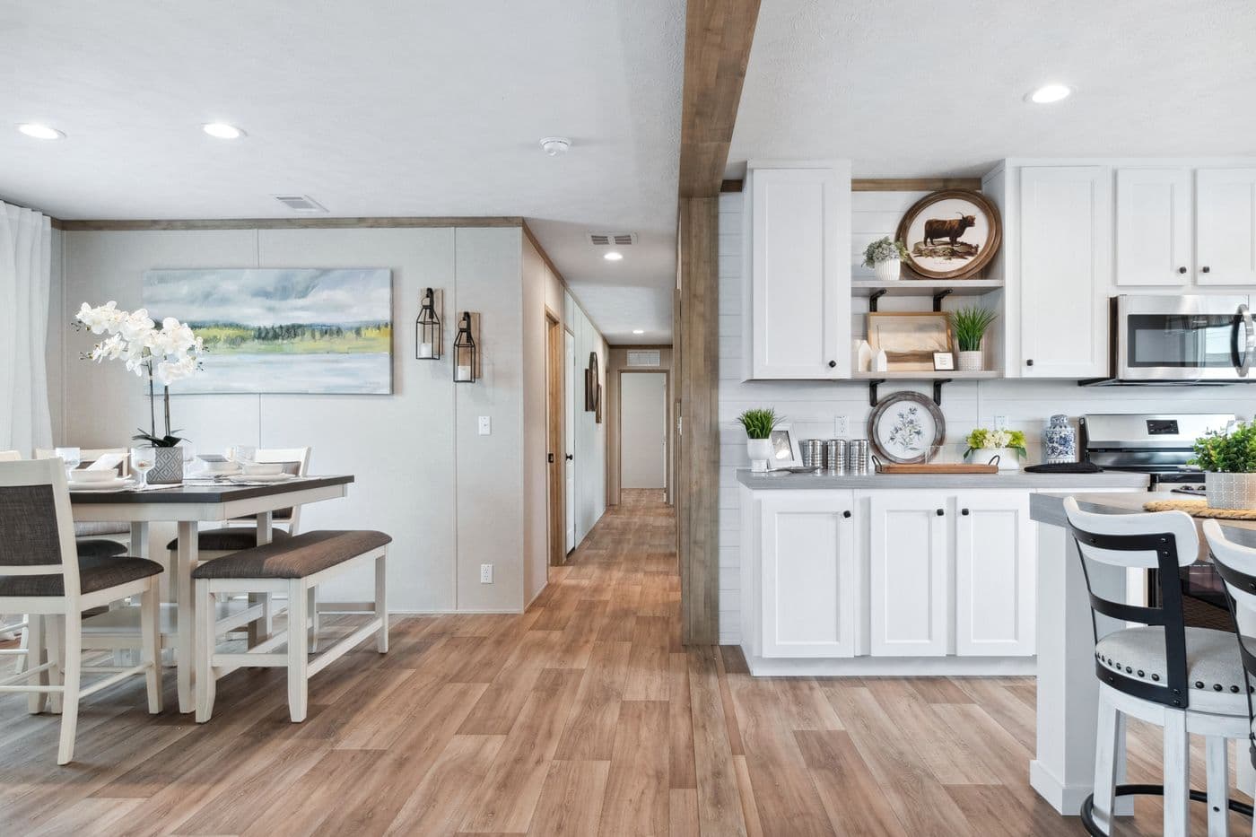 The BREEZE FARMHOUSE 72 Dining Area. This Manufactured Mobile Home features 4 bedrooms and 2 baths.