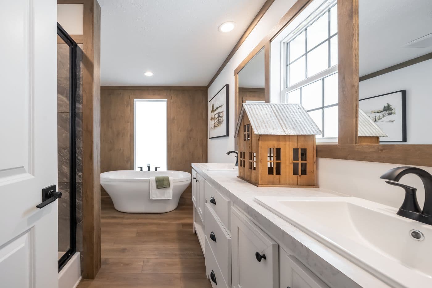 The THE LIZZIE Primary Bathroom. This Manufactured Mobile Home features 3 bedrooms and 2 baths.
