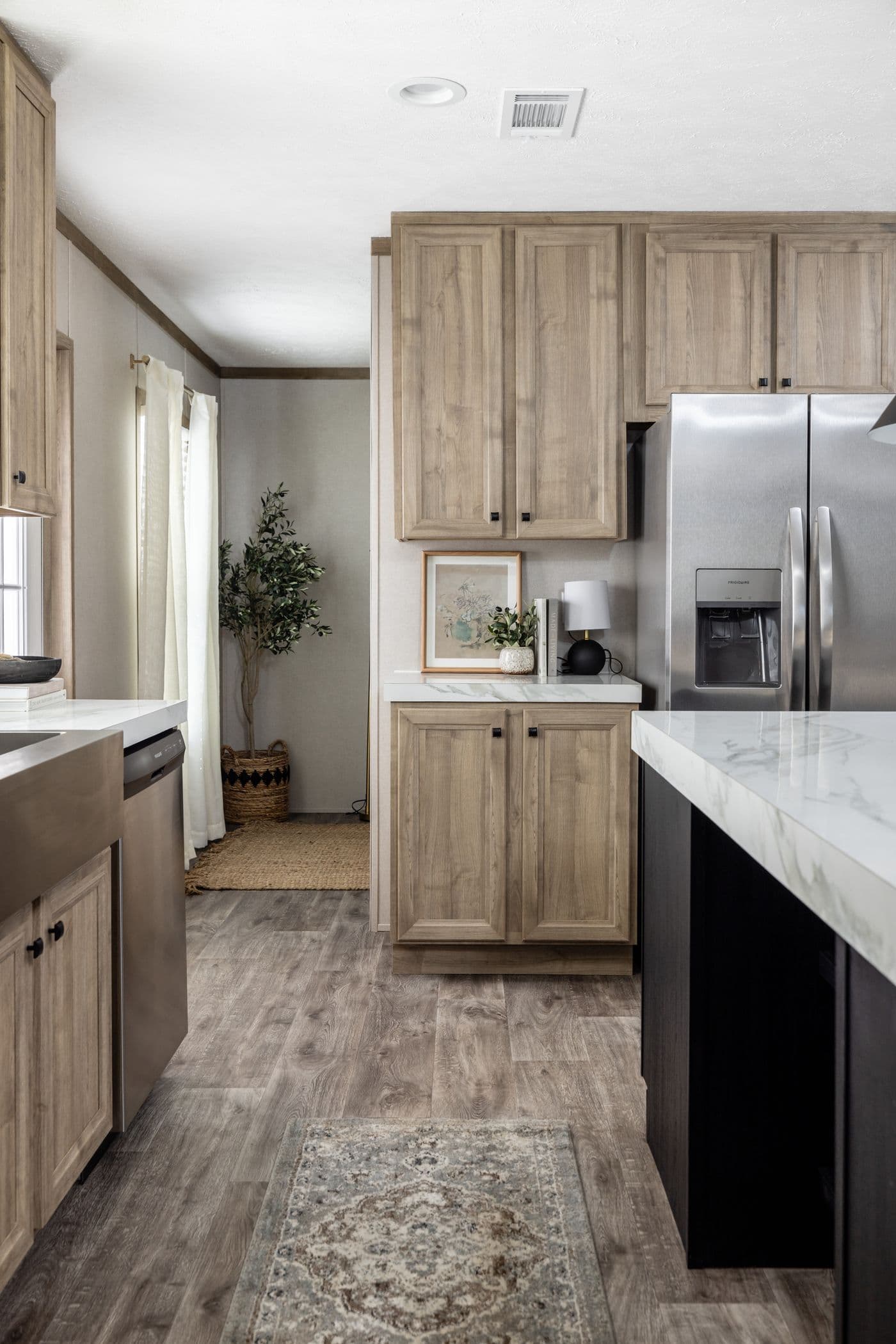The STERLING ANNIVERSARY Kitchen. This Manufactured Mobile Home features 3 bedrooms and 2 baths.