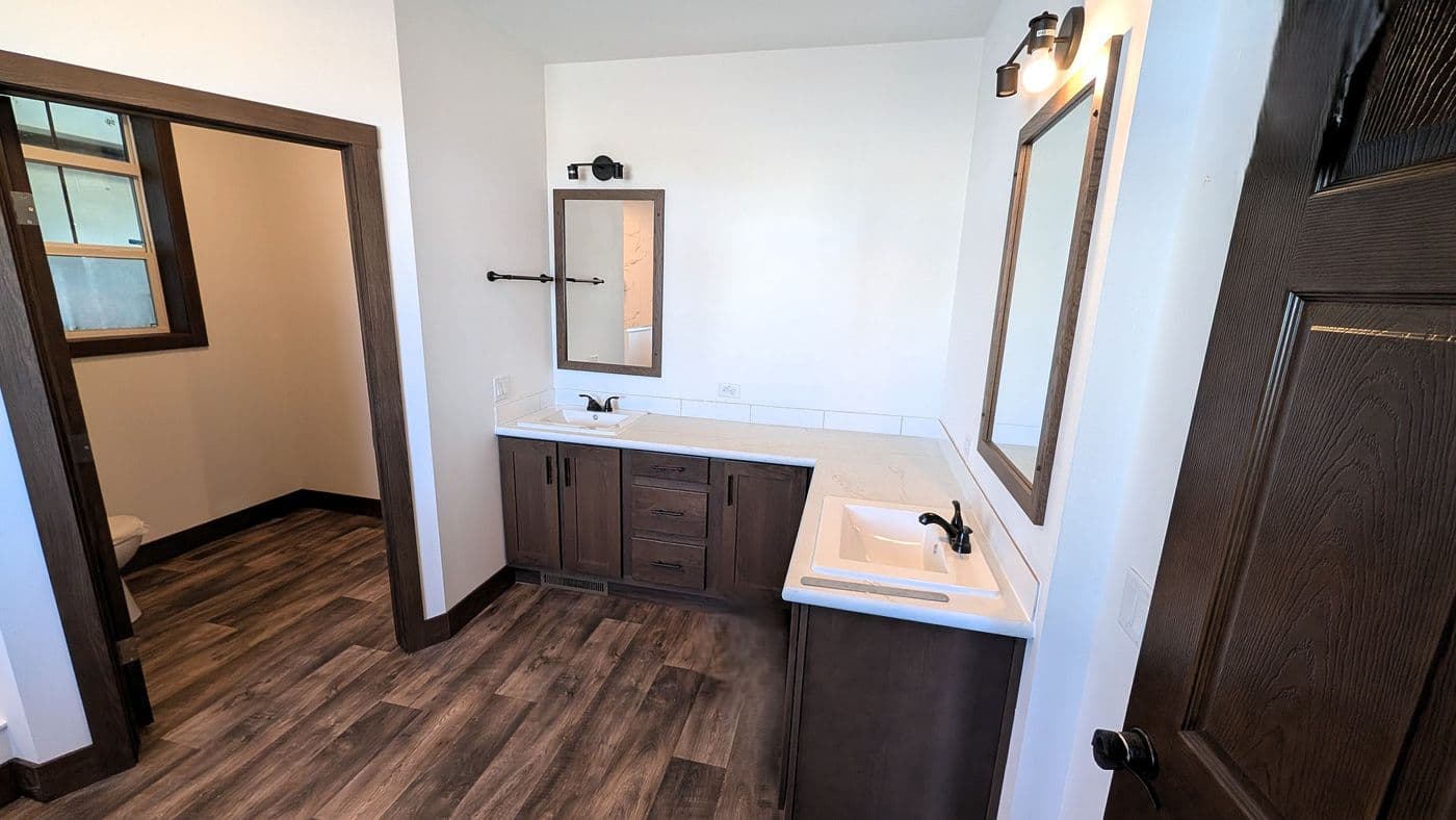 The LEGEND 402 MOD Primary Bathroom. This Modular Home features 3 bedrooms and 2 baths.