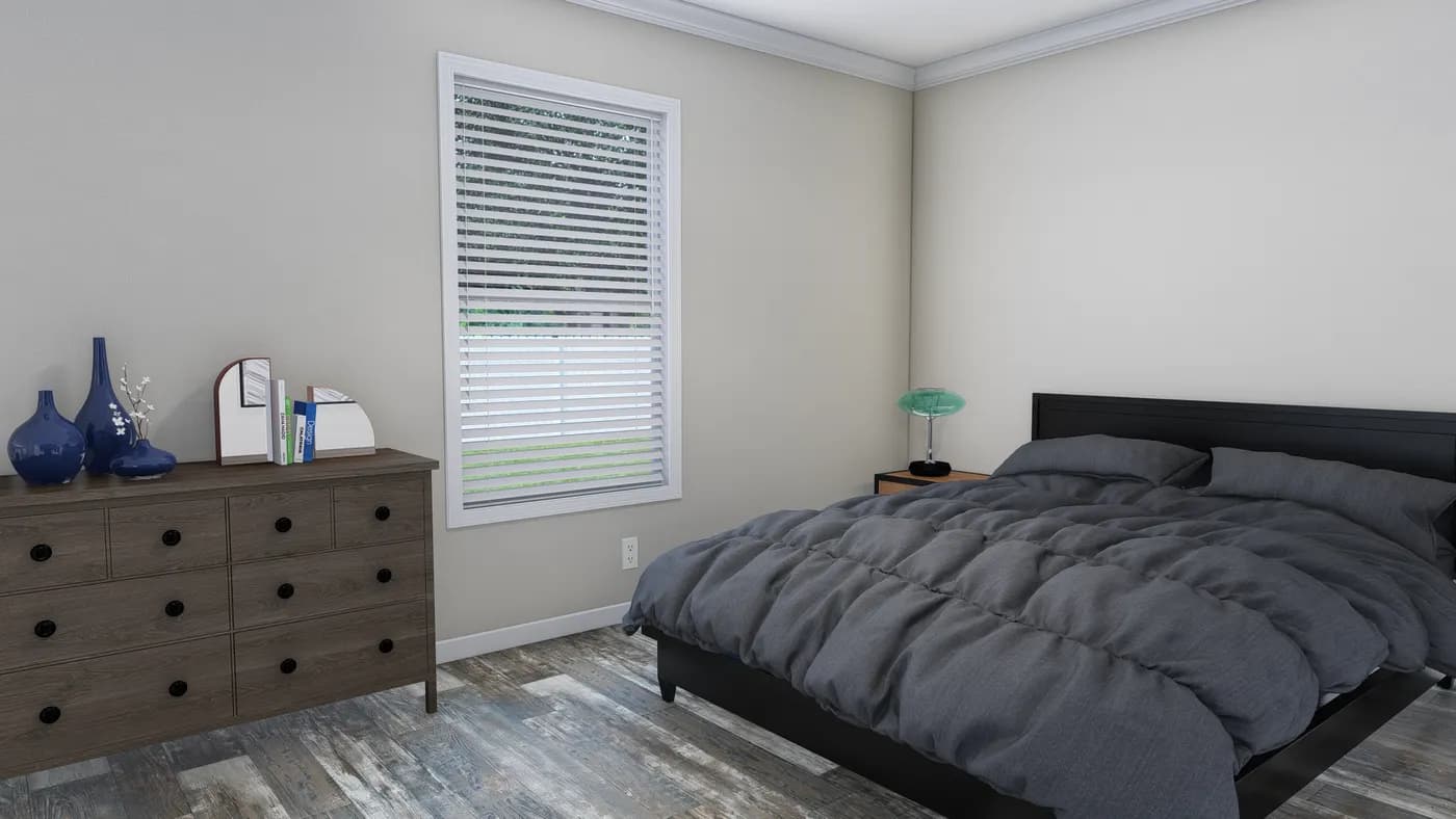 The CAROLINIAN M5000 Bedroom. This Manufactured Mobile Home features 3 bedrooms and 2 baths.
