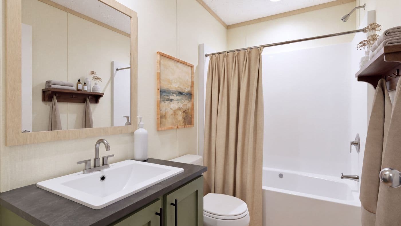 The BOONE Guest Bathroom. This Manufactured Mobile Home features 4 bedrooms and 2 baths.