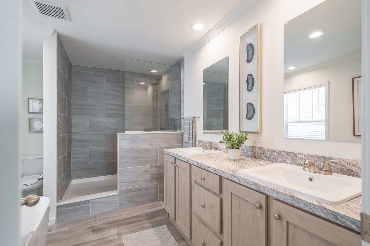 The 5410 "RIVER" 5628 Primary Bathroom. This Manufactured Mobile Home features 3 bedrooms and 2 baths.