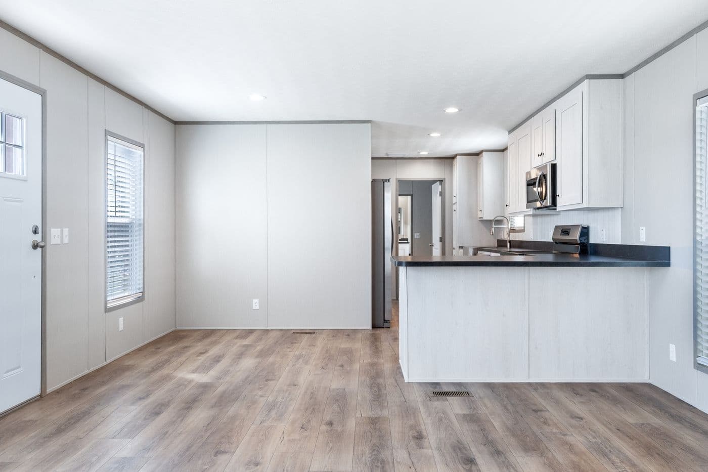 The RESOLUTION 16763K Living Room. This Manufactured Mobile Home features 3 bedrooms and 2 baths.