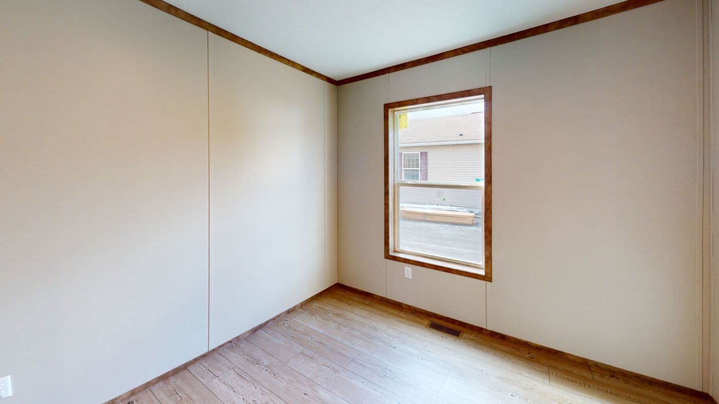 The BOONE Guest Bedroom. This Manufactured Mobile Home features 4 bedrooms and 2 baths.