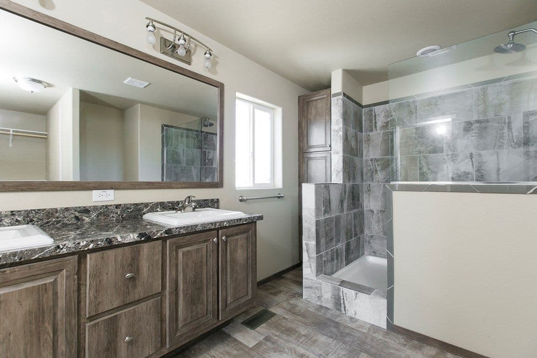 The 2022 COLUMBIA RIVER (NEW) Primary Bathroom. This Manufactured Mobile Home features 3 bedrooms and 2 baths.