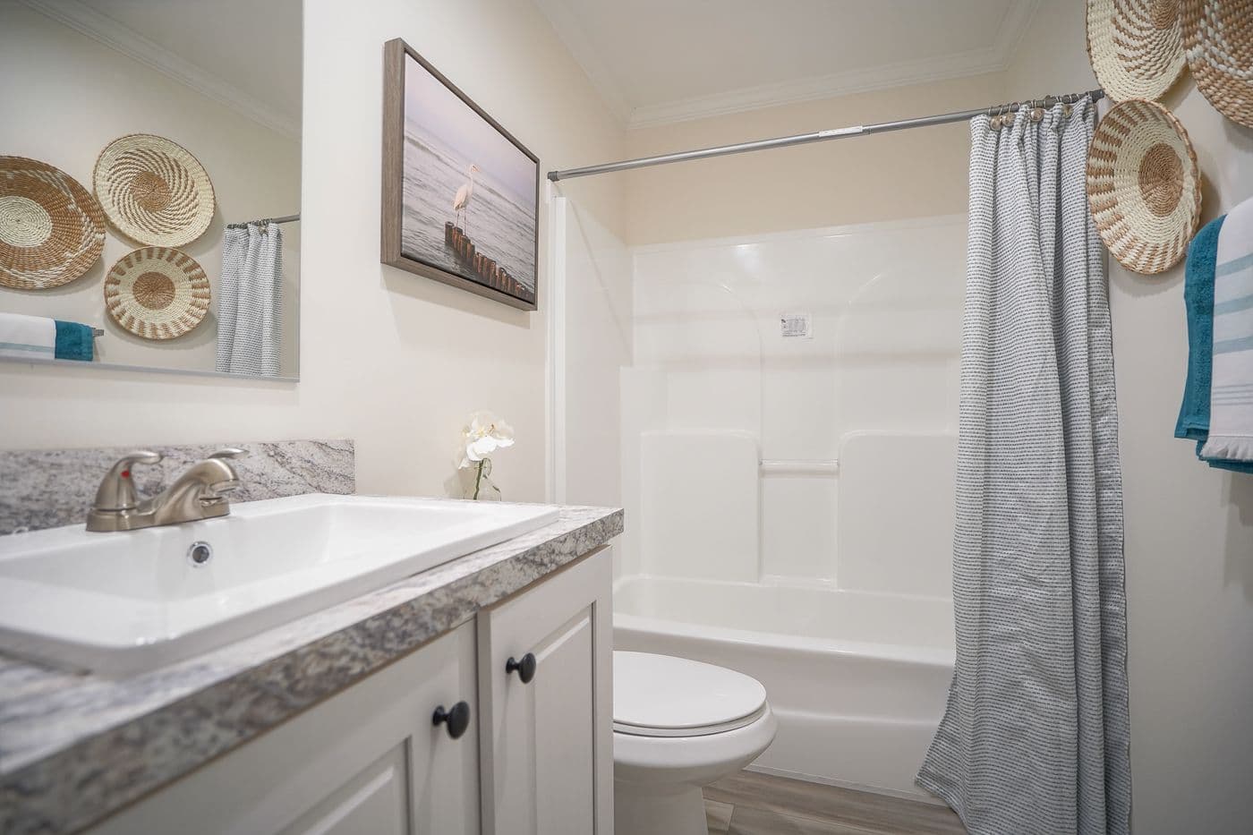 The 777-2 "COOL BREEZE" 7616 Guest Bathroom. This Manufactured Mobile Home features 3 bedrooms and 2 baths.