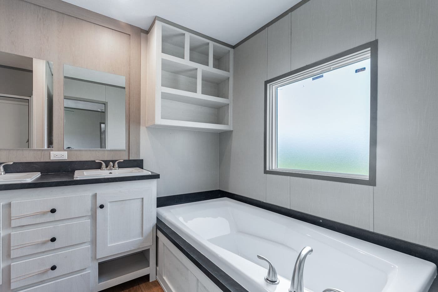 The RESOLUTION 16763H Primary Bathroom. This Manufactured Mobile Home features 3 bedrooms and 2 baths.