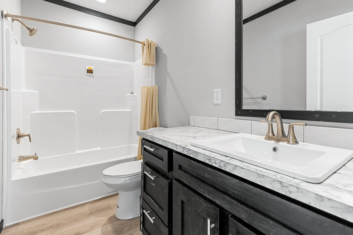 The THE SIERRA Guest Bathroom. This Manufactured Mobile Home features 4 bedrooms and 2 baths.