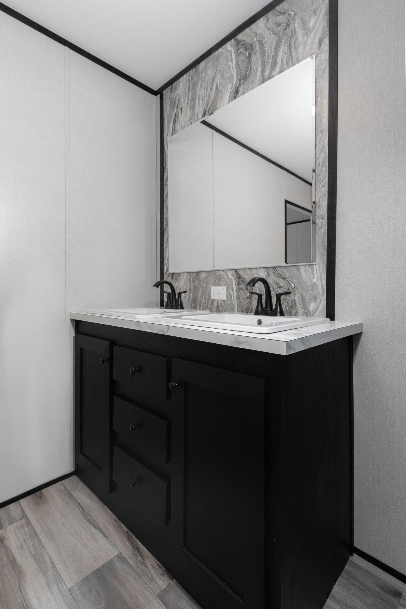 The THE SMOKEY Primary Bathroom. This Manufactured Mobile Home features 3 bedrooms and 2 baths.