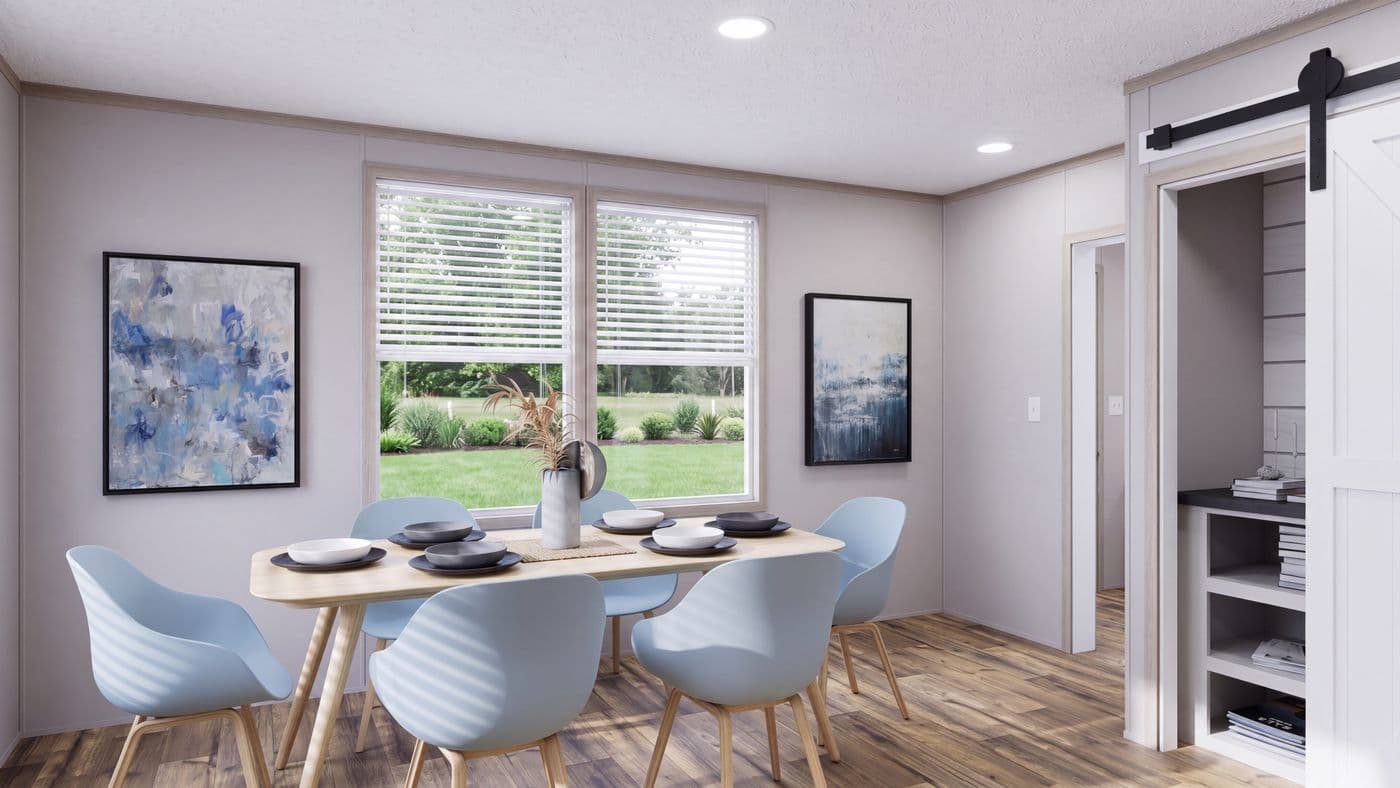 The MOUNTAIN BREEZE 3260 Dining Area. This Manufactured Mobile Home features 3 bedrooms and 2 baths.