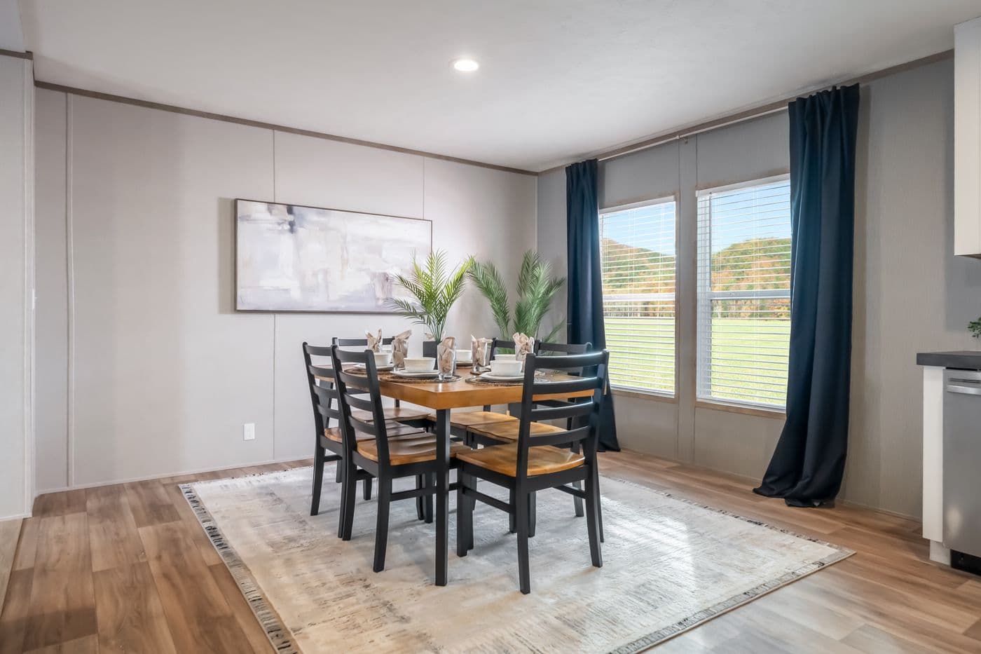 The ECLIPSE Dining Area. This Manufactured Mobile Home features 4 bedrooms and 2 baths.