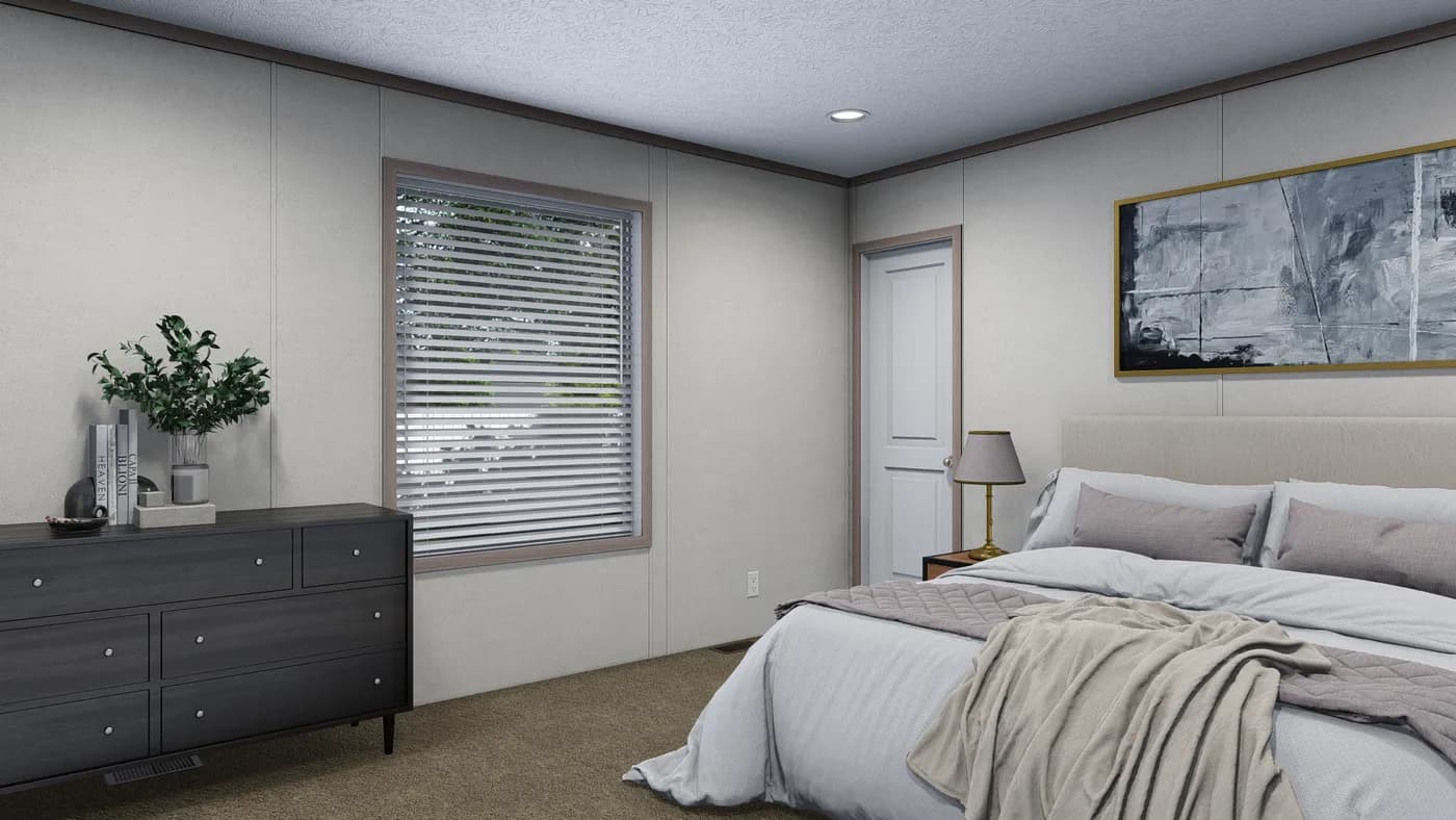 The 5628-E845P THE PULSE Primary Bedroom. This Manufactured Mobile Home features 3 bedrooms and 2 baths.