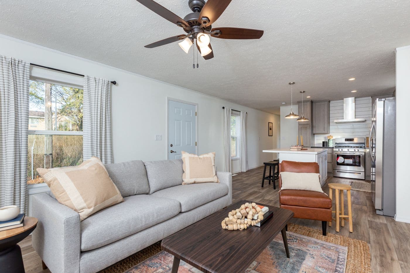 The LIFESTYLE 208 Living Room. This Manufactured Mobile Home features 3 bedrooms and 2 baths.