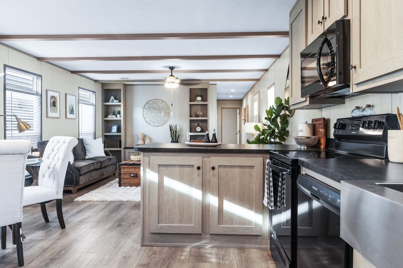 The ANNIVERSARY 16763A Kitchen. This Manufactured Mobile Home features 3 bedrooms and 2 baths.