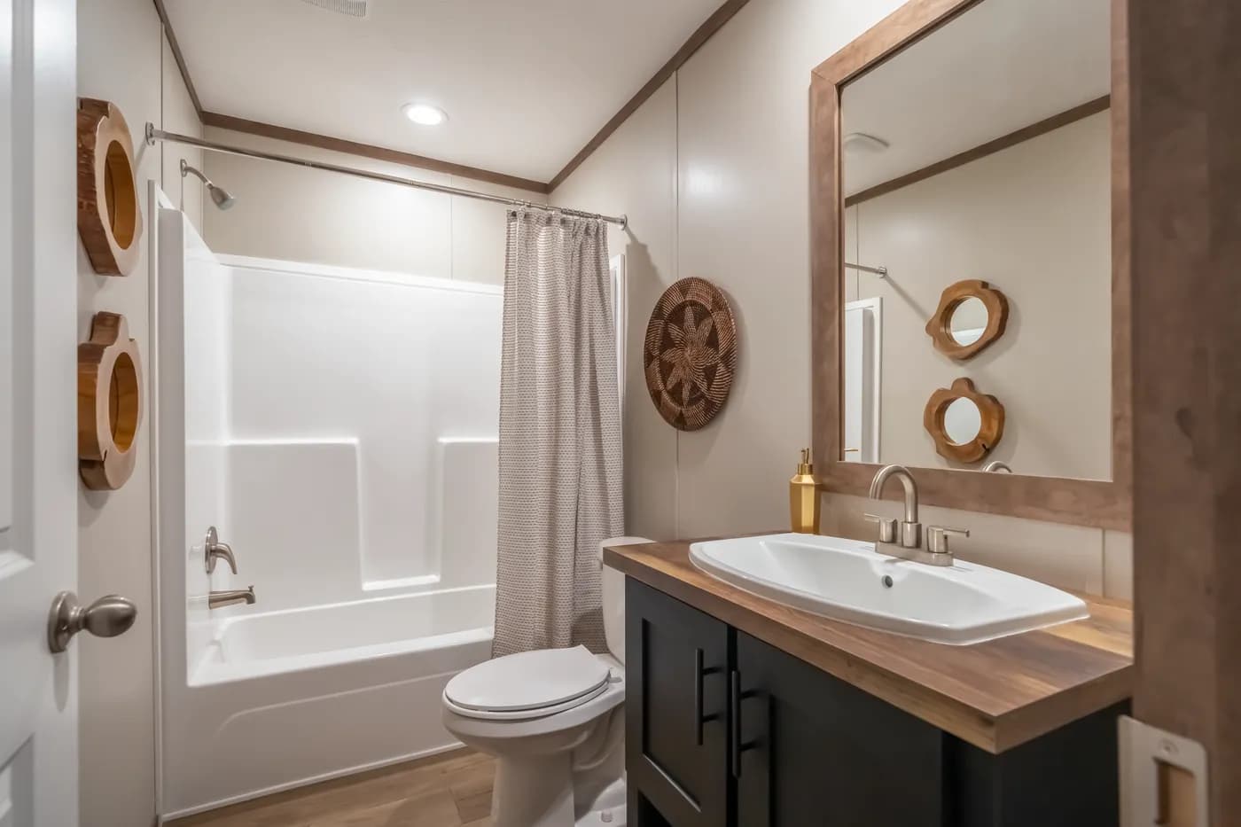 The SEVIER Guest Bathroom. This Manufactured Mobile Home features 4 bedrooms and 3 baths.