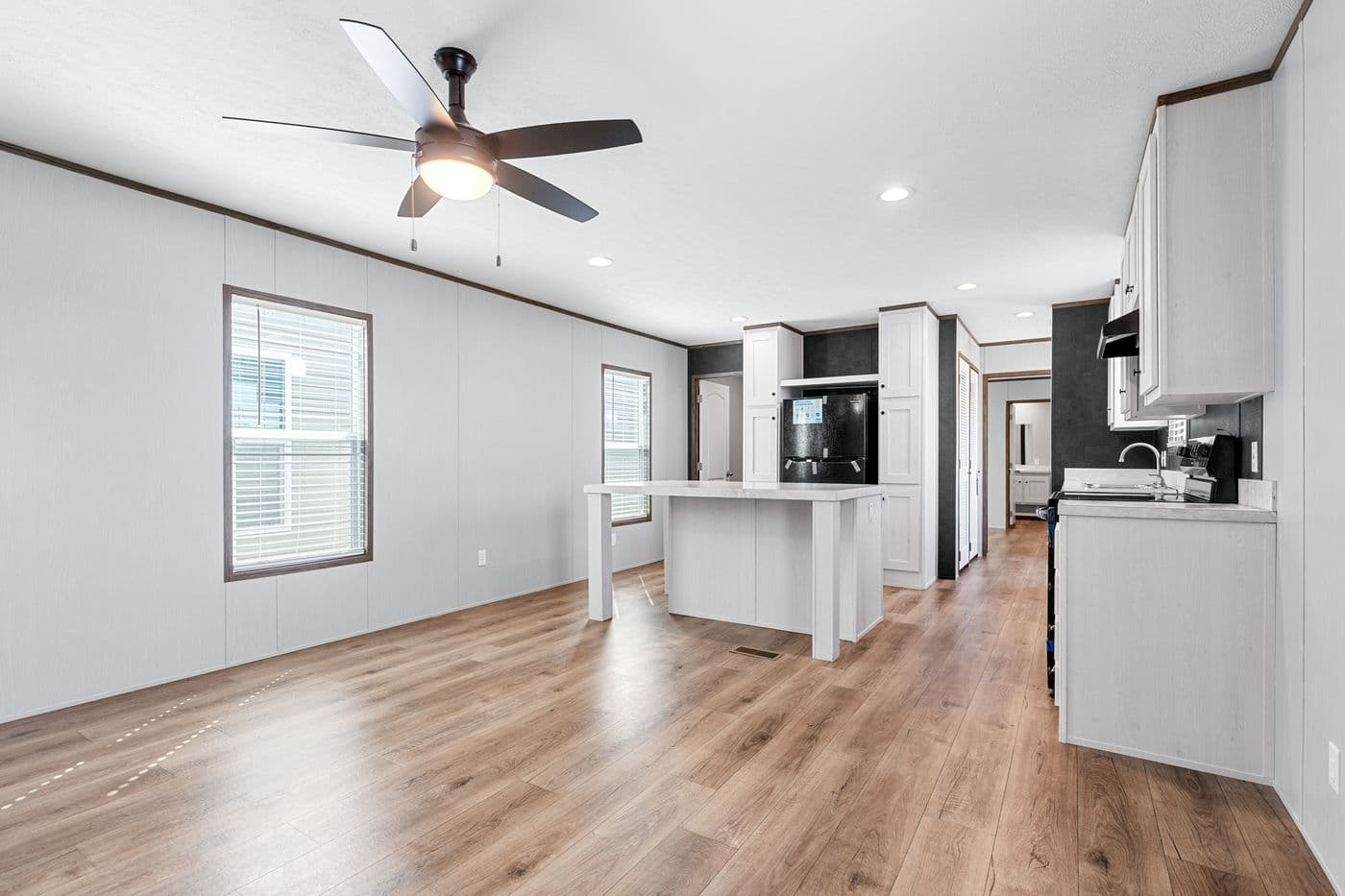 The HOMESTEAD 16602A Kitchen. This Manufactured Mobile Home features 2 bedrooms and 2 baths.