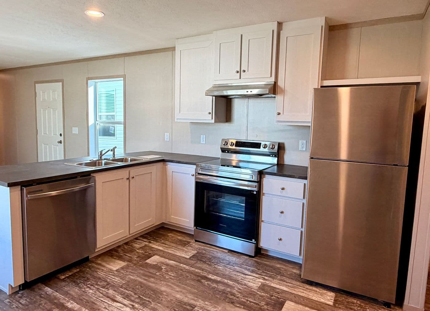 The JEFFERSON Kitchen. This Manufactured Mobile Home features 3 bedrooms and 2 baths.