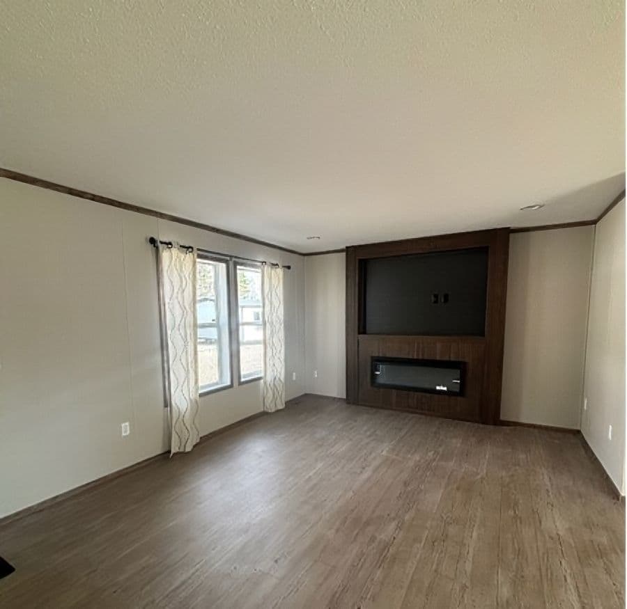 The APATITE 44 Living Room. This Manufactured Mobile Home features 3 bedrooms and 2 baths.